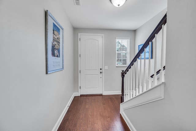 foyer with dark hardwood / wood-style floors