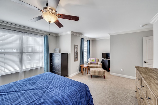 bedroom featuring multiple windows, ceiling fan, and crown molding