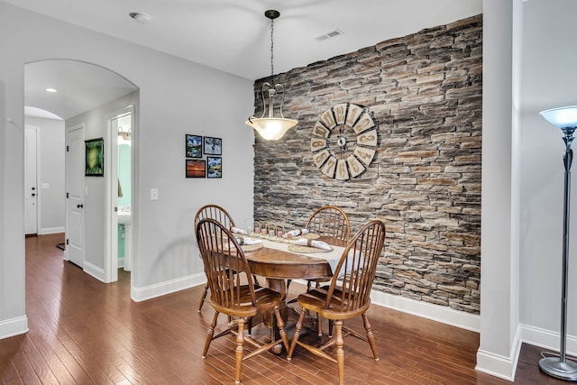 dining space with dark hardwood / wood-style floors