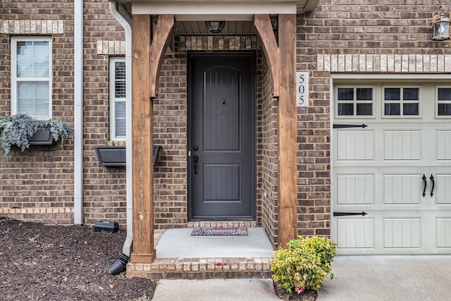 entrance to property featuring a garage