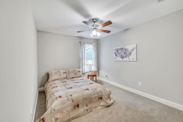 bedroom featuring ceiling fan and carpet