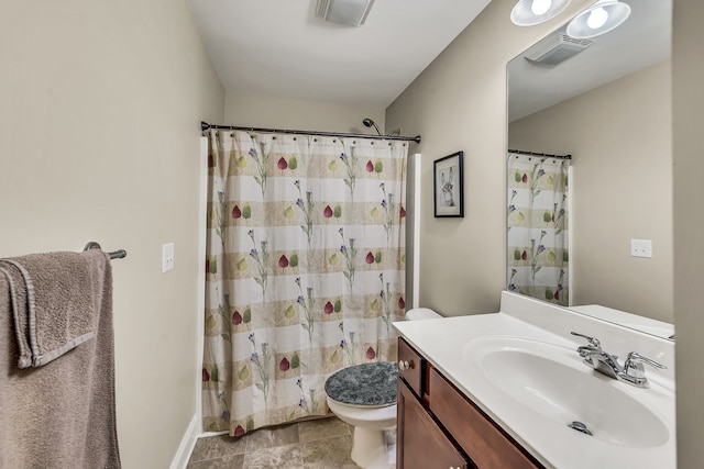 bathroom featuring a shower with curtain, tile patterned flooring, vanity, and toilet