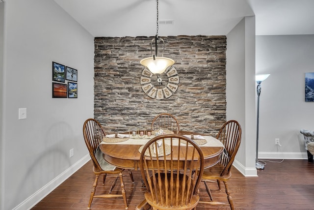 dining area with dark hardwood / wood-style floors