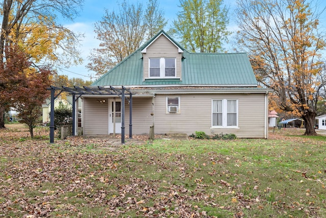 rear view of property with a pergola and a yard