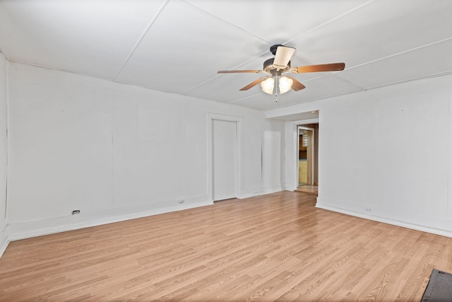 spare room featuring ceiling fan and light hardwood / wood-style floors