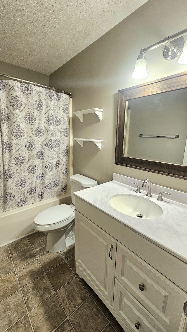 full bathroom with a textured ceiling, vanity, shower / tub combo, and toilet