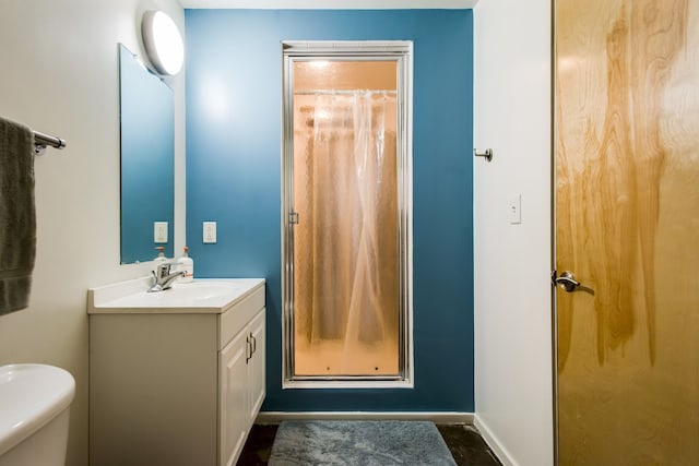 bathroom with vanity and toilet