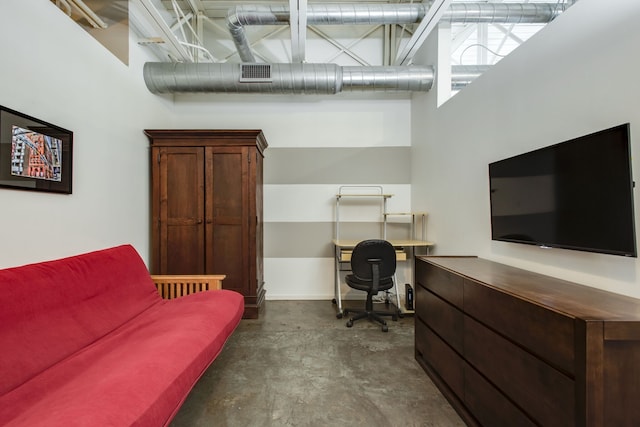 office space featuring a towering ceiling