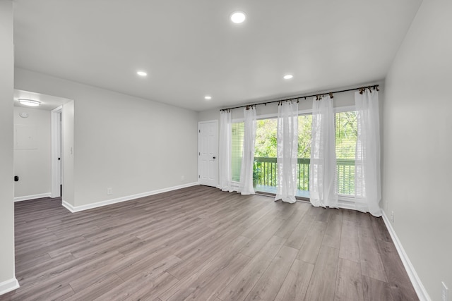 empty room with light hardwood / wood-style floors