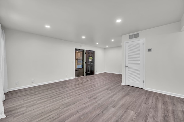 unfurnished room with light hardwood / wood-style flooring