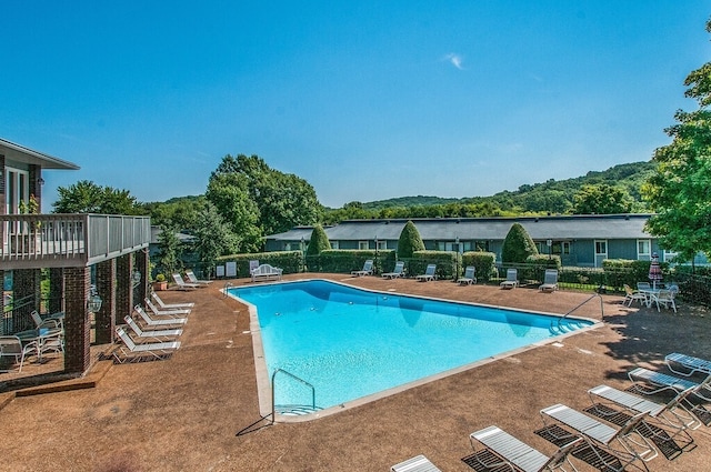 view of swimming pool featuring a patio area