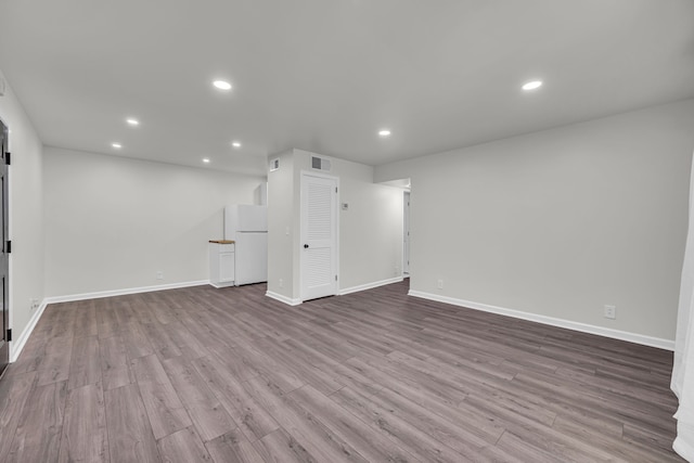 unfurnished living room with light hardwood / wood-style floors