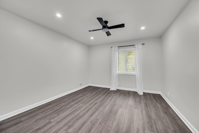 spare room with wood-type flooring and ceiling fan