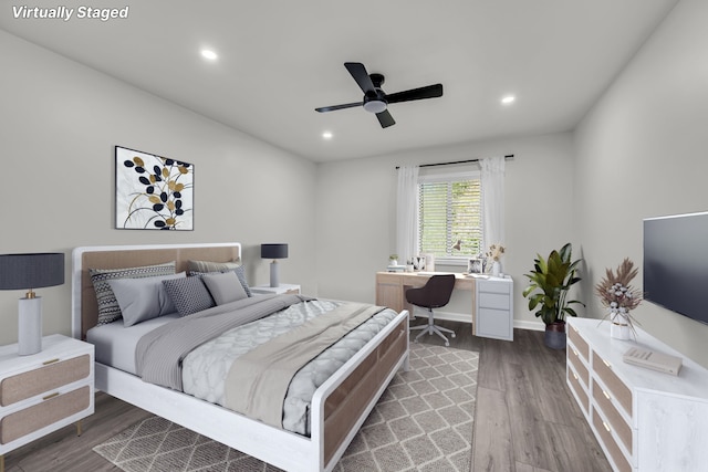 bedroom featuring hardwood / wood-style floors and ceiling fan