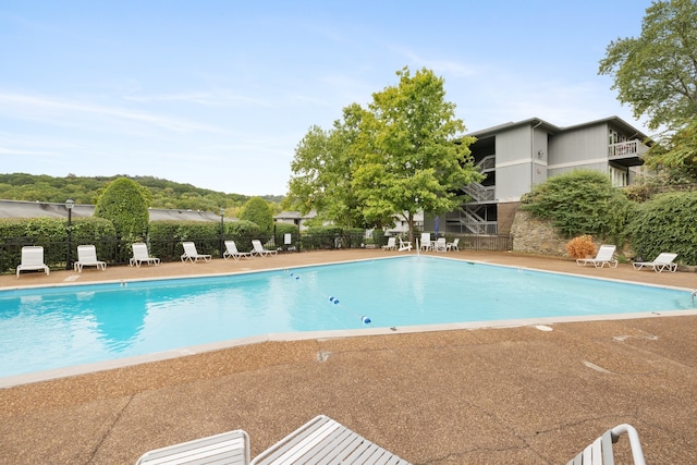 view of pool featuring a patio