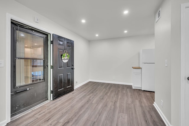 entrance foyer with light hardwood / wood-style floors