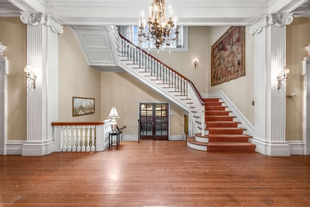 foyer featuring hardwood / wood-style floors and a notable chandelier