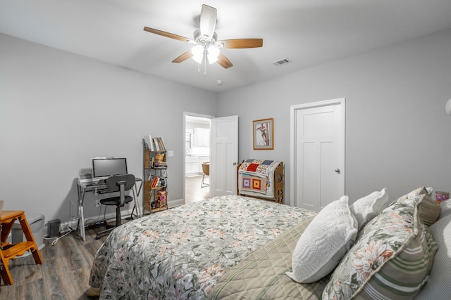 bedroom featuring ceiling fan and dark wood-type flooring