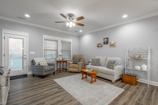 living room featuring crown molding, dark hardwood / wood-style flooring, and ceiling fan