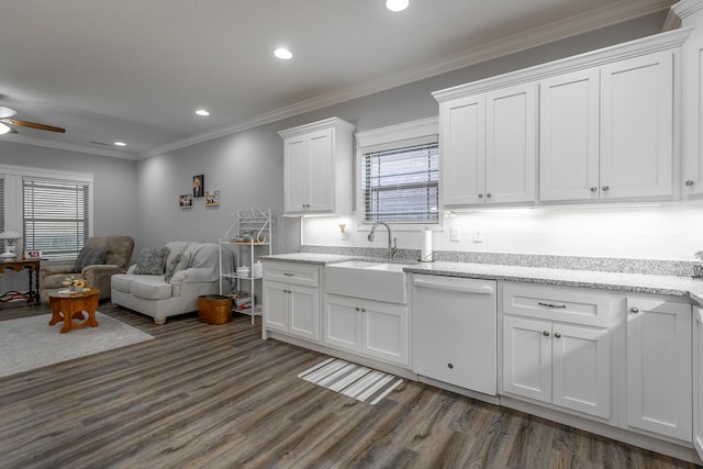 kitchen with sink, dark hardwood / wood-style floors, crown molding, white dishwasher, and white cabinets