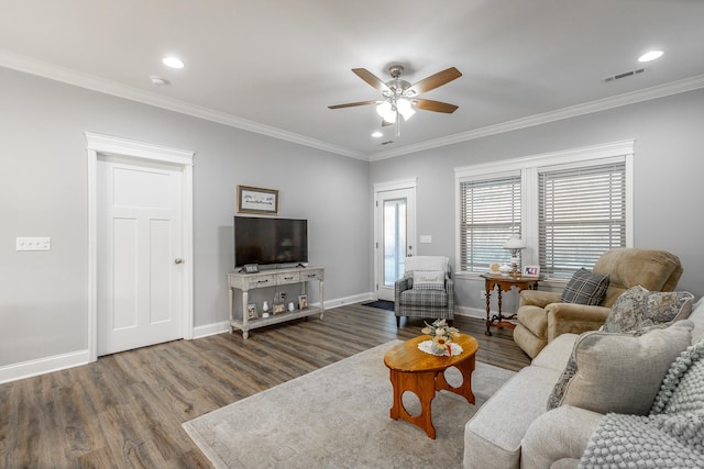 living room featuring wood-type flooring, ceiling fan, and ornamental molding