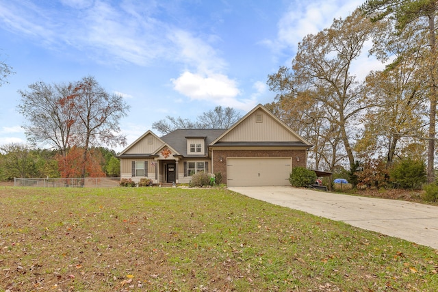 craftsman-style house featuring a front yard and a garage