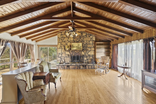 unfurnished living room featuring a stone fireplace, a wealth of natural light, light hardwood / wood-style flooring, and wood ceiling