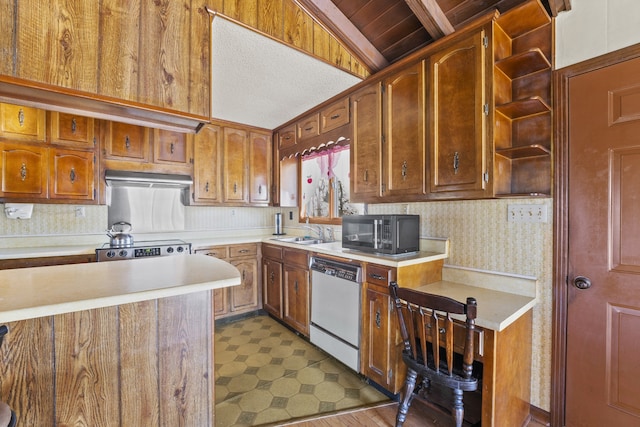 kitchen featuring stainless steel range, white dishwasher, lofted ceiling, and sink