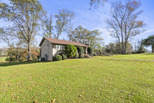 view of yard featuring central AC unit