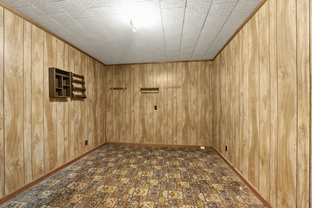 empty room featuring wood walls