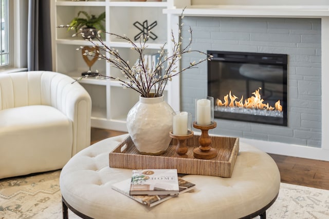 room details featuring hardwood / wood-style flooring and a fireplace