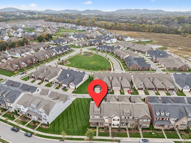 birds eye view of property with a mountain view