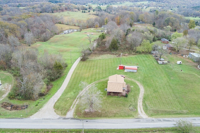 birds eye view of property with a rural view