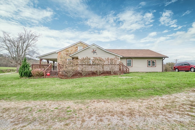 rear view of property with a yard