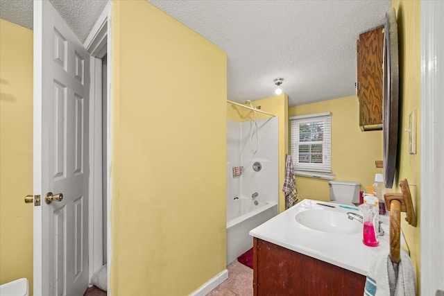 full bathroom featuring tub / shower combination, tile patterned floors, a textured ceiling, toilet, and vanity