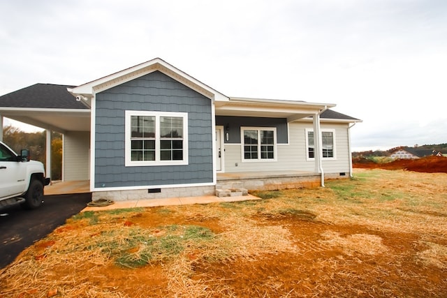 view of front of home featuring a carport