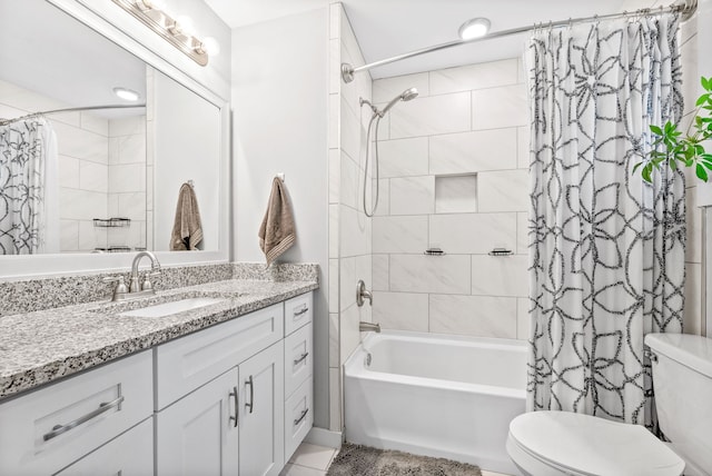 full bathroom with shower / bath combo, vanity, toilet, and tile patterned floors