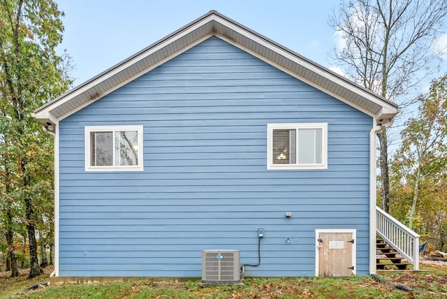 view of side of property featuring central air condition unit