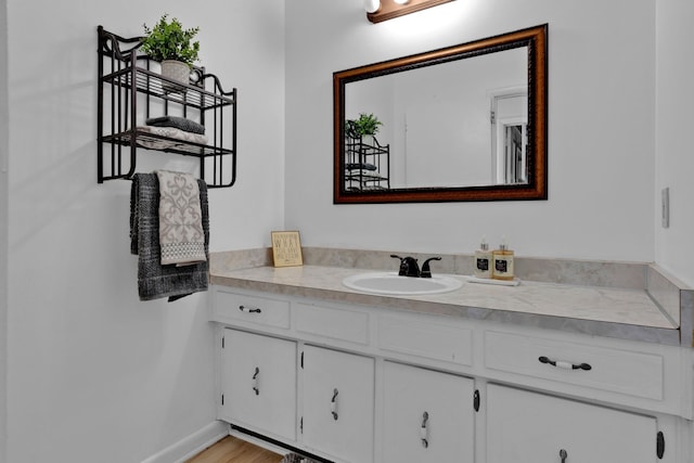 bathroom featuring vanity and wood-type flooring