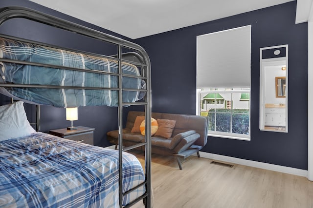 bedroom featuring wood-type flooring