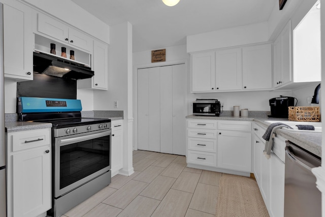 kitchen with white cabinetry and appliances with stainless steel finishes