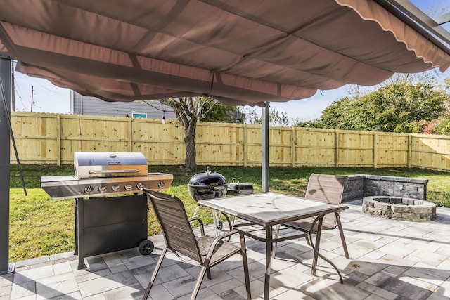 view of patio with a fire pit and grilling area