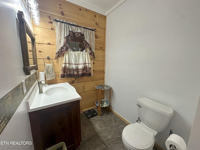 bathroom with tile patterned flooring, vanity, and toilet