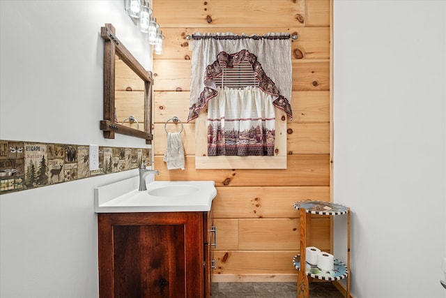 bathroom featuring tile patterned flooring and vanity