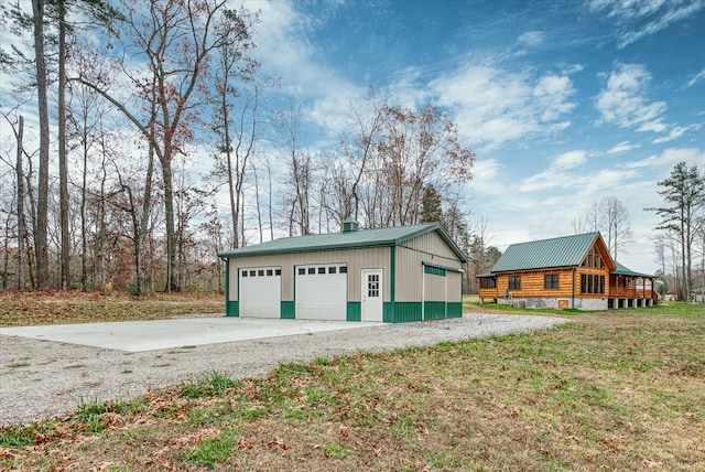 garage featuring a lawn