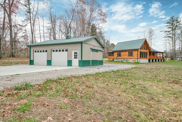 garage with a lawn