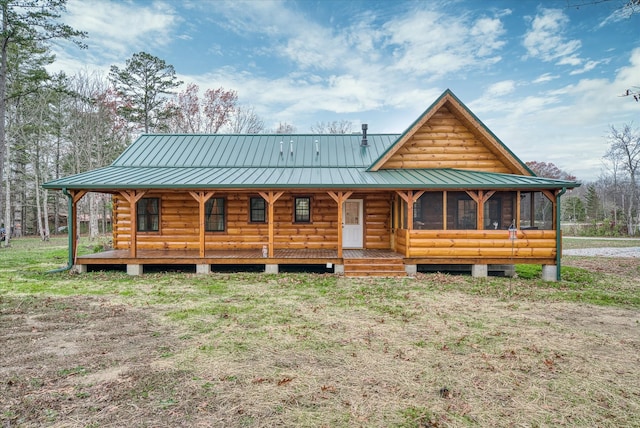 log home with a sunroom