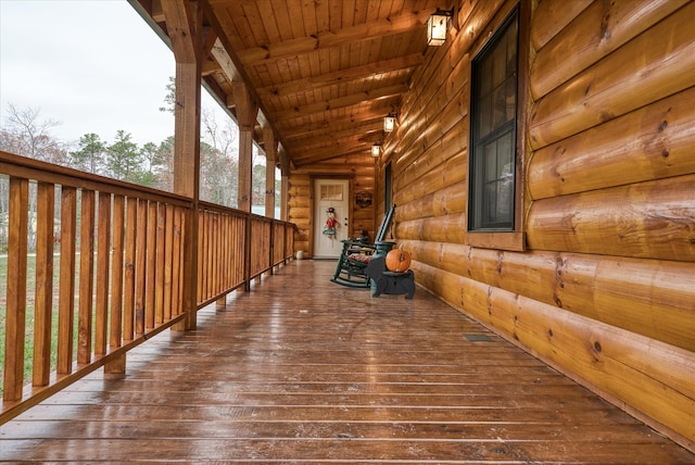 wooden terrace with a porch