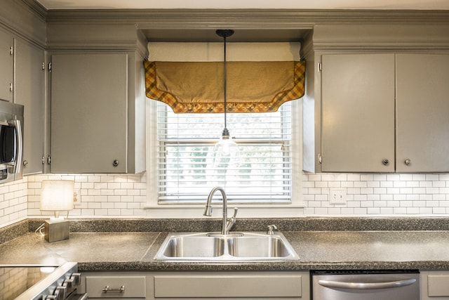 kitchen with sink, gray cabinets, and stainless steel appliances