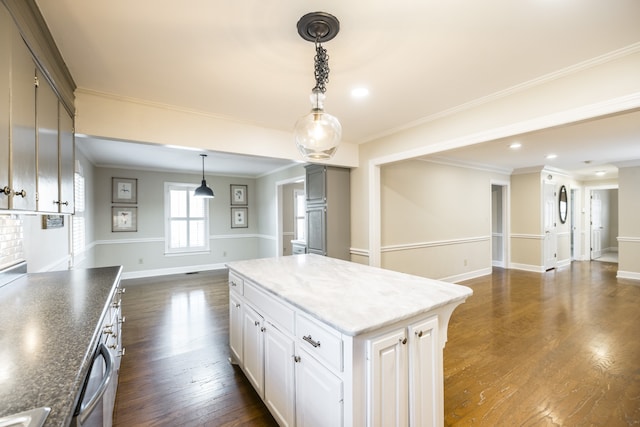 kitchen featuring white cabinetry, crown molding, dark hardwood / wood-style flooring, and a kitchen island